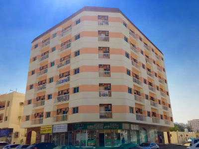 A two-room apartment with a hallway, two bathrooms, a kitchen, and a balcony is available for rent on a yearly basis for 23,000 dirhams.