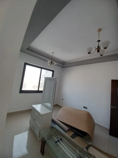 Apartment with two bedrooms, a hallway, two bathrooms, and a balcony for rent in Al Nuaimiya 2 in Ajman.