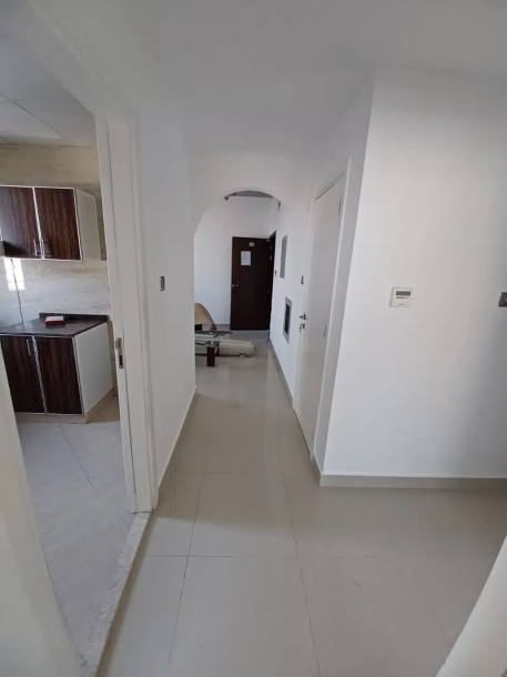 Apartment with two bedrooms, a hallway, two bathrooms, and a balcony for rent in Al Nuaimiya 2 in Ajman.-10